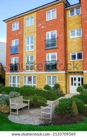 New built apartments for sale. Modern block of flats with for sale signs in the windows. empty homes in UK