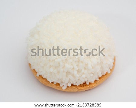 cake with coconut crumbs on a white background