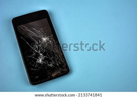 Mobile smartphone with broken screen isolated on white.Damaged mobile phone, cracked modern touch screen.Electronics repair service, accident insurance concept.