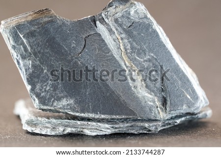 Slate, stone splinters, wood splinters, shingle is a collective term for different tectonically deformed and also metamorphic sedimentary rocks photographed in the studio