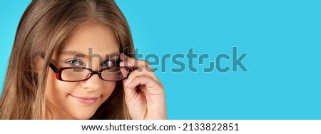 Healthy eyes and vision. Portrait nerd kid child with question face wearing eyes glasses. Royalty-Free Stock Photo #2133822851