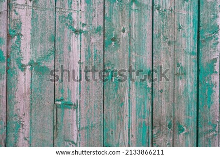 Empty clear old painted wooden background with vertical stripes, copy space. Old fashioned wood texture with scratches and scrapes. Green colored photo filter