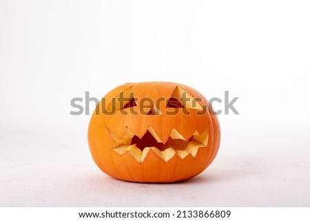 Composition of halloween jack o lantern and copy space on white background. horror, fright, halloween tradition and celebration concept digitally generated image.