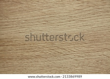 Wood texture with a stripe pattern made of natural wood. Light beige background