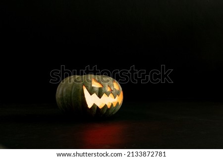 Composition of halloween jack o lantern and copy space on black background. horror, fright, halloween tradition and celebration concept digitally generated image.