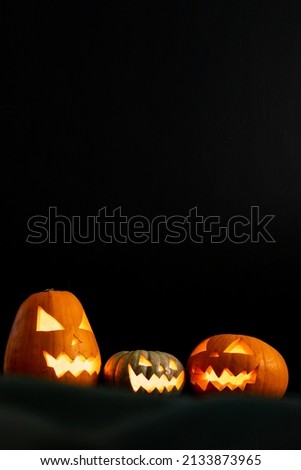 Composition of halloween jack o lanterns and copy space on black background. horror, fright, halloween tradition and celebration concept digitally generated image.