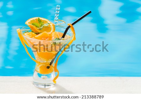 Fresh Orange Mojito by the swimming pool