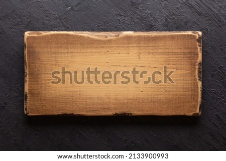 Wooden nameplate or sign board on wall background. Front view of name plate Royalty-Free Stock Photo #2133900993