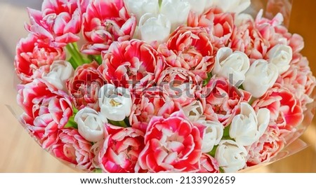 beautiful bouquet on the table, top view, close-up with blurred background, peony rose, pink rose, purple rose, greenery