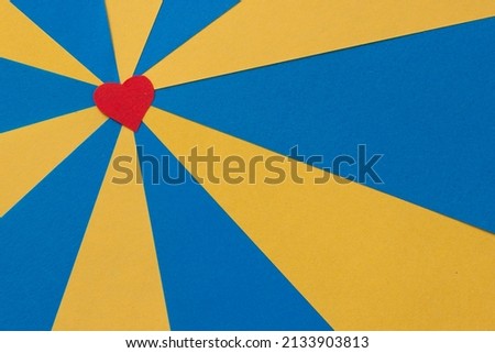 Yellow blue rays red heart from color paper