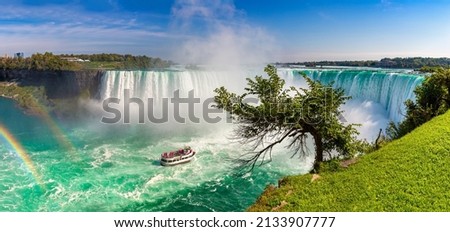 Panorama of Canadian side view of Niagara Falls, Horseshoe Falls and boat tours in Niagara Falls, Ontario, Canada Royalty-Free Stock Photo #2133907777