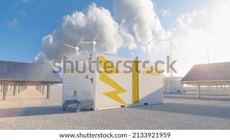 modern battery energy storage system with wind turbines and solar panel power plants in background Royalty-Free Stock Photo #2133921959
