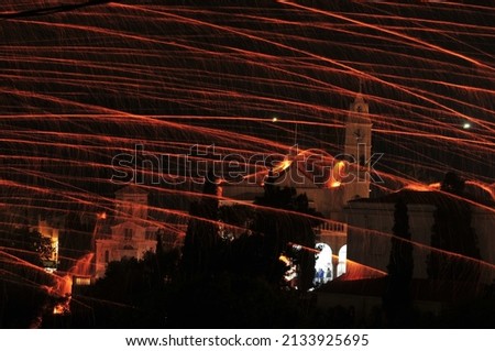 rocketwar is a tradition that happens every easter between the 2 orthodox churches at vrontados Chios island Greece. Royalty-Free Stock Photo #2133925695
