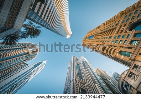 
Modern glass skyscrapers in Dubai with blue sky in background. Impressive architecture of financial district and Dubai marina. 
 Royalty-Free Stock Photo #2133944477