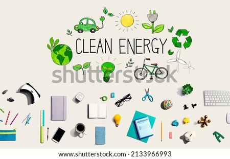 Clean energy concept with collection of electronic gadgets and office supplies