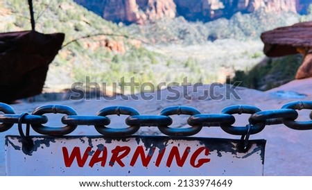 Warning Sign on Chains at National Park Cliff Edge