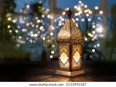 Seasonal greeting card, Ramadan lantern  lit during Ramadan time. Royalty-Free Stock Photo #2133995587