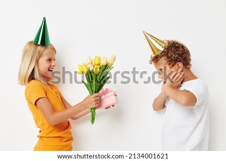 girl giving a gift to a boy birthday surprise