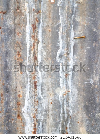 Rusted galvanized iron plate, which is for a temporary fence.