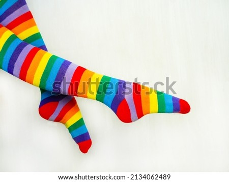 Colorful striped socks. Knee-length multicolored knit socks.