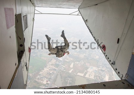 Picture of a person parachuting from a plane