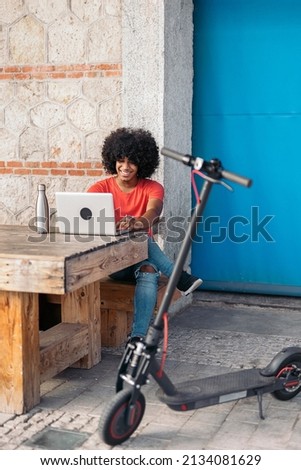 Cheerful African American Boy Using Laptop