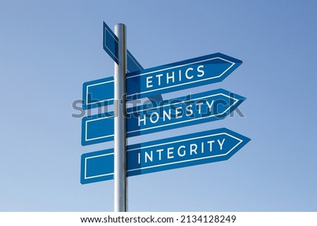 Ethics honesty integrity words on signpost isolated on sky background Royalty-Free Stock Photo #2134128249
