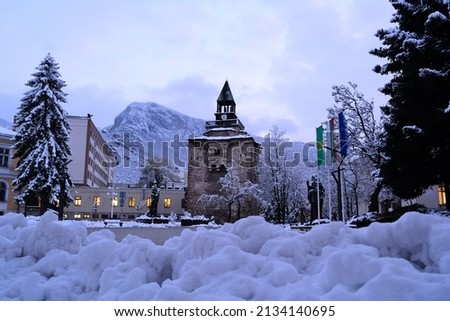 Winter at the city of Vratsa, Bulgaria. Winter picture of stone clock tower of covered with snow city.