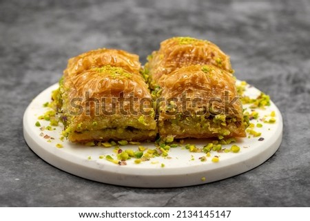 Pistachio baklava. Close-up. Traditional Middle Eastern Flavors. Traditional Turkish baklava. local name fistikli baklava Royalty-Free Stock Photo #2134145147