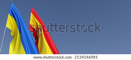Flags of Spain and Ukraine on flagpoles on the sides. Flags on a blue background. Place for text. Independent free Ukraine. Spanish flag. Commonwealth. 3D illustration.