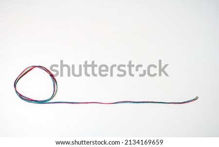 Cotton fiber spun into threads for sewing, knitting or weaving. Royalty-Free Stock Photo #2134169659