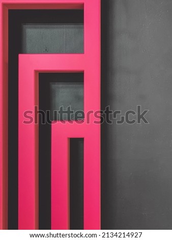 Pink shapes on a gray background with blur
