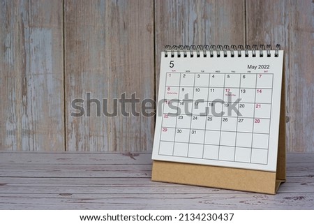 White May 2022 calendar on wooden desk. 2022 new year concept. Copy space.