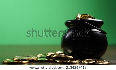 Pot of gold in front of green background for St. Patrick's Day template.                              
