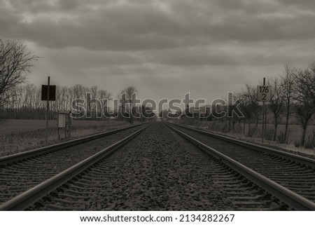 Railroad tracks to the horizon. The leading lines guide the view to the center of the picture