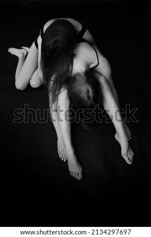 two dancers engage in contact improvisation