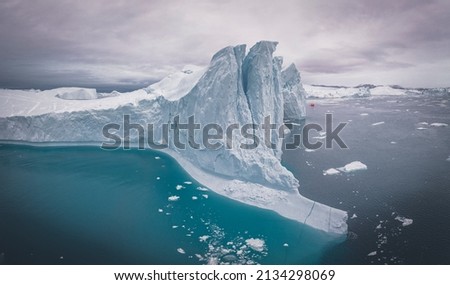 icebergs floating on the sea from aerial point o f view in panoramic