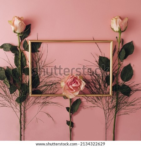 frame on a pink background with roses