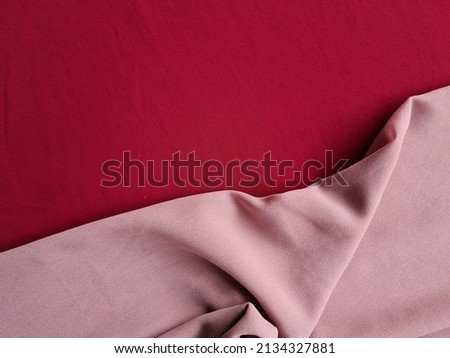 Abstract background of dark red cloth combined with other colors