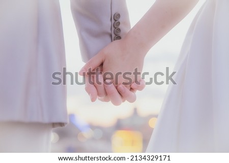 A picture of two holding hands