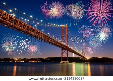 Fireworks celebration near The 25 de Abril bridge in Lisbon. Portugal Royalty-Free Stock Photo #2134330039