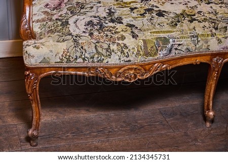 Old antique sofa photographed with flash in restaurant 