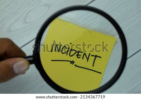 Incident write on sticky notes isolated on Wooden Table. Royalty-Free Stock Photo #2134367719