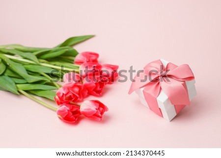 Colorful pink tulips and gift box with copy space. Background for womens day, 8 March, Valentines day, Saint Valentine 14 february. Flat lay, Greeting card, banner, invitation, flyer, discount