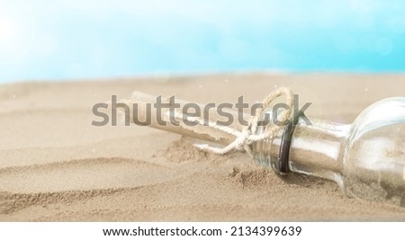 Sandy Beach with a Message in the Bottle