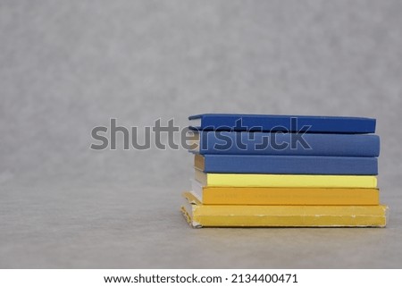 Stack of books on gray,Ukraine