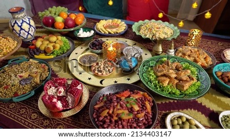 Ramadan iftars marks the end of fasting. Table with dates, Oriental food and sweets. Eid mubarak. Traditional Middle Eastern cuisine, evening meal Royalty-Free Stock Photo #2134403147