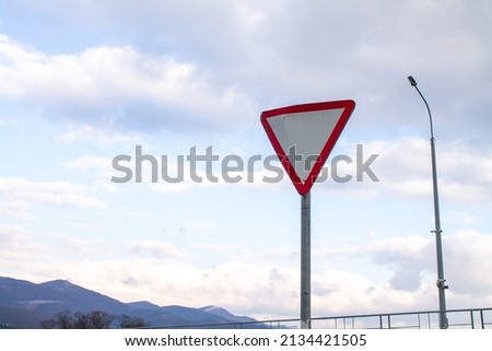 European signal give way to blue sky.