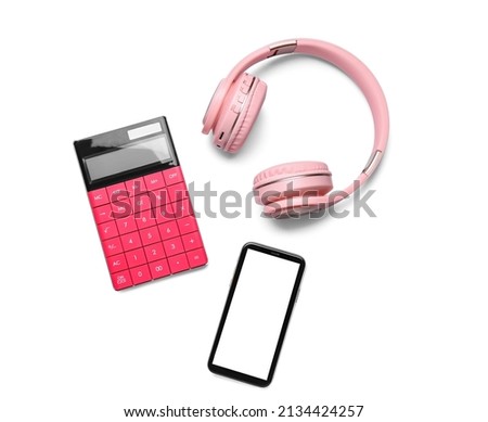 Mobile phone, headphones and calculator on white background