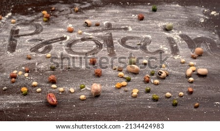 Mixed dry organic cereal and grain seed pile on wooden background. For healthy food ingredient or carbohydrate food type and agricultural product concept. Royalty-Free Stock Photo #2134424983